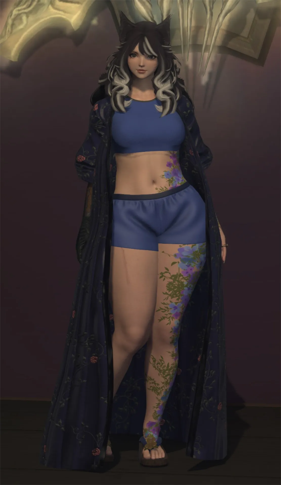 Lazne in a blue night robe, cropped tee, and shorts for bedtime.